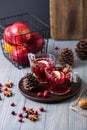 Mulled wine in glasses on a wooden background. Apples, cranberries, cinnamon, star anise Royalty Free Stock Photo