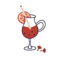 Mulled wine, hot winter drink in wineglass. Warm Christmas beverage in glass with orange slice, clove and straw. Spiced