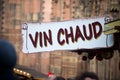 mulled wine sign at the christmas market, traduction of vin chaud in french
