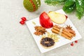 Mulled wine with spices in a pot with traditional Christmas decor. Hot beverage, festive background Royalty Free Stock Photo