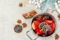 Mulled wine with spices in a pot with traditional Christmas decor. Hot beverage, festive background Royalty Free Stock Photo