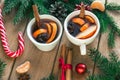 Mulled wine. Traditional Christmas and winter drink with red wine, citrus and spices and Christmas decorations