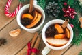 Mulled wine. Traditional Christmas and winter drink with red wine, citrus and spices and Christmas decorations