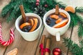 Mulled wine. Traditional Christmas and winter drink with red wine, citrus and spices and Christmas decorations