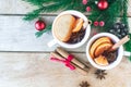 Mulled wine. Traditional Christmas and winter drink with red wine, citrus and spices and Christmas decorations