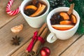 Mulled wine. Traditional Christmas and winter drink with red wine, citrus and spices and Christmas decorations