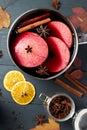 Mulled wine. Winter hot drink with citrus, apple and spices.