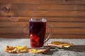 Mulled wine on a wooden and linen background