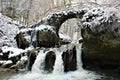 Mullerthal, Luxembourg - January 2024 - Schiessentumpel Waterfall under snow Royalty Free Stock Photo