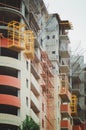 A multi-apartment building under construction, vertical photography.