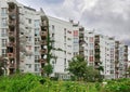 Multi-apartment residential building overgrown with plants. District of Favoriten, Vienna, Austria Royalty Free Stock Photo