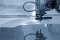 The multi-axis waterjet cutting machine cutting the aluminum plate