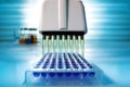 Multi channel pipette loading biological samples in microplate f