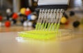 Multi channel pipette withdrawing green fluorophore compound solution with plastic tips for biomedical research with bright Royalty Free Stock Photo