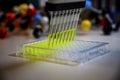 Multi channel pipette withdrawing green fluorophore compound solution from 96 well plate with plastic tips for biomedical research Royalty Free Stock Photo
