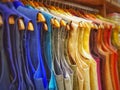 Multi color dress sherwani kurta hanging from hangar in a garment shop for sale Royalty Free Stock Photo