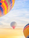 Multi color hot air balloon flying over sunrise sky Royalty Free Stock Photo