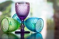 Multi color little glasses with reflection in bokeh background Royalty Free Stock Photo