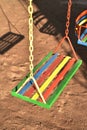 Multi-color painted swing for child on playground