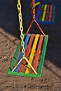 Multi-color painted swing for child on playground