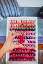 Multi color Spools of thread needlework, sewing, tailoring and tailoring concept woman hand Royalty Free Stock Photo