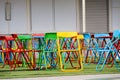 Multi-color steel chair set on green plastic grass In the playground Royalty Free Stock Photo