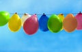 multi colored balloons hanging in front of blue sky Royalty Free Stock Photo