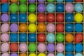 Multi-colored balls on a wooden bench. Game of throwing darts into balls, fun in the park. The concept of entertainment and fun.