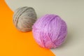 Multi colored balls of yarn on two tone background Royalty Free Stock Photo