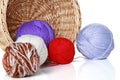 Multi-colored balls of yarn in wicker basket Royalty Free Stock Photo