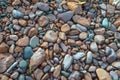 Multi colored beach stones on the shore of Lake Superior, background, texture Royalty Free Stock Photo