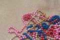 Multi-colored beads on a background fabric Royalty Free Stock Photo