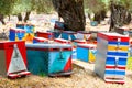 Multi-colored beehives, apiary, honey, many beehives that look like people, coniferous honey on the island of Thassos