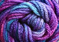 Multi  colored blue purple  macro of a spool of yarn Royalty Free Stock Photo