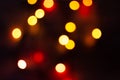 Multi-colored bokeh on a black background. Bright blurry textures of holiday lights Royalty Free Stock Photo