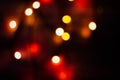 Multi-colored bokeh on a black background. Bright blurry textures of holiday lights Royalty Free Stock Photo