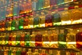 Multi-colored bottles in the window. Royalty Free Stock Photo