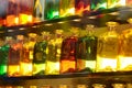 Multi-colored bottles in the window. Royalty Free Stock Photo