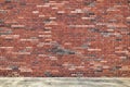 Multi-colored brick wall background and sidewalk Royalty Free Stock Photo