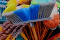 Multi-colored bright brushes, mops for manual cleaning of premises from dust and dirt. Artificial pile  plastic handles Royalty Free Stock Photo