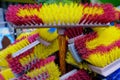 Multi-colored bright brushes, mops for manual cleaning of premises from dust and dirt. Artificial pile  plastic handles Royalty Free Stock Photo