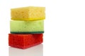 Multi-colored bright sponges for cleaning. Kitchen assistants in the fight for cleanliness. Isolated on white background. Space Royalty Free Stock Photo