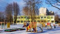 Multi-colored building of a kindergarten with a playground for games