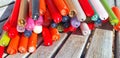 Multi-colored burnt candles lie in a row. Royalty Free Stock Photo