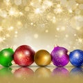 Multi-colored Christmas balls on a gold background