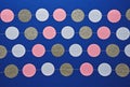 Multi-colored circles lie on periodicity rhythm on classic blue Royalty Free Stock Photo