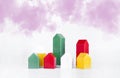 Multi-colored constructor. Miniature model of the house. Pink clouds. On white background. Royalty Free Stock Photo