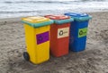 multi-colored containers for sorting garbage are on the beach ag Royalty Free Stock Photo