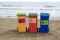 multi-colored containers for sorting garbage are on the beach ag Royalty Free Stock Photo
