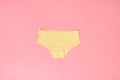 Multi-colored cotton panties for a girl on a pink background Royalty Free Stock Photo